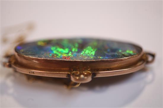 An Edwardian 9ct gold and black opal brooch, 51mm.